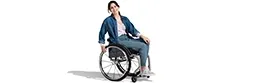 A woman in a wheelchair.